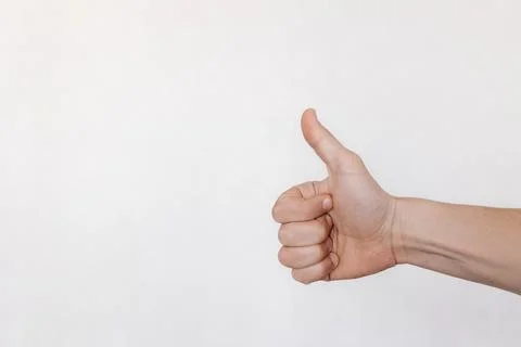 Hand on white background with thumb up Stockfoto's
