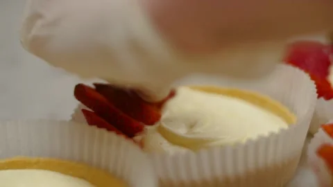 Hand in white glove is adding strawberries Stock-Footage 138272258