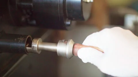 Hand white glove pulling roast coffee beans example from roaster machine Stock-Footage 156250946