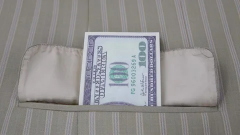 Hand in a white glove pulls out a pack of 100 dollar bills from a jacket pocket. 스톡 동영상 145535290