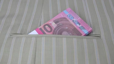 Hand in white glove pulls a pack of 10 Euro banknotes out of his jacket pocket Vídeo Stock 145465981