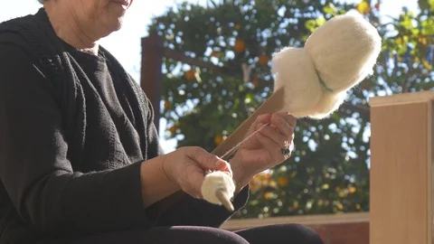 Hand Winding Wool Yarn On A Spindle Authentic Traditional Way (1 of 13) Stock Footage 98320853