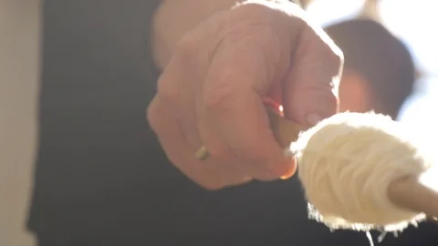 Hand Winding Wool Yarn On A Spindle Authentic Traditional Way (8 of 13) Stock Footage 98335949