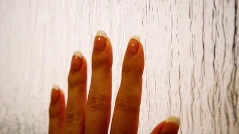 Hand on window Stock Footage 101022709