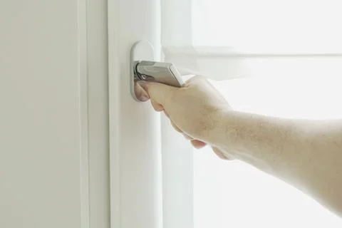 Hand on windows Stock Photos