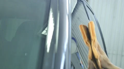 Hand wipe cleaning the car with microfiber cloth Stock Footage 68505142