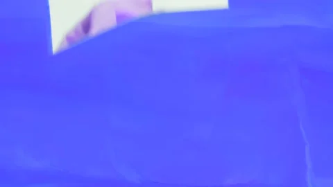 Hand wipes the blue paint off the screen. Wiping the paints on the glass wi.. Stock Footage 236993905