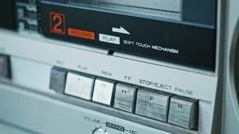 Hand wipes panel of old fashioned tape recorder. Careful attitude to outdated Stock Footage 153552724