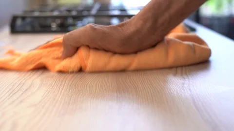 A hand is wiping and cleaning the table Stock Footage 283537297