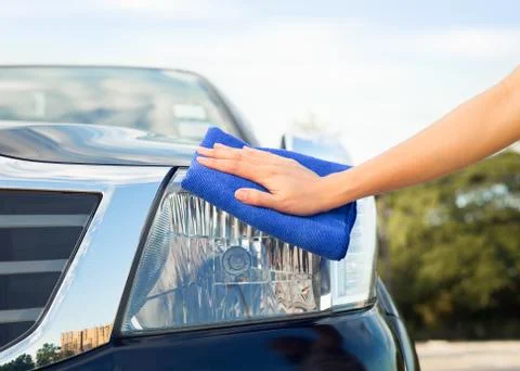 Hand wiping car Stock Photos