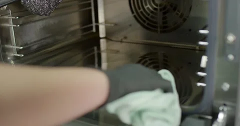 Hand Wiping Metal Grille Inside Kitchen Vent With White Cloth Stock Footage 340275518