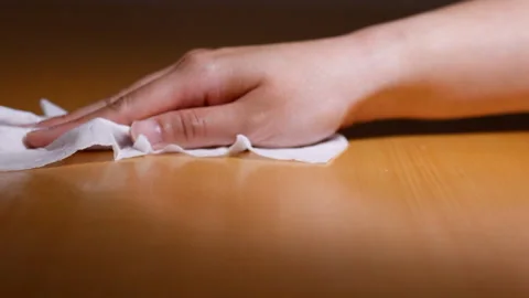 Hand wiping table desk surface Stock Footage 137498727