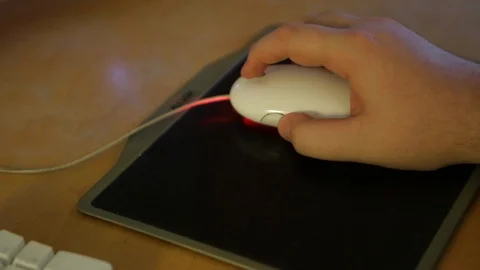Hand on wired white computer mouse with mouse pad Video stock 125491809