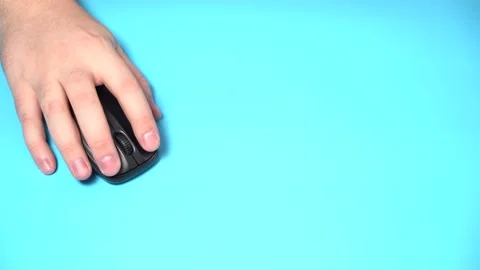 Hand with Wireless Computer Mouse Moves and Clicks Video stock 156936086