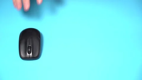Hand with Wireless Computer Mouse Moves and Clicks Stock Footage 166226742