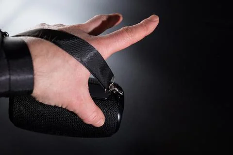 Hand with wireless portable speaker. Stock Photos
