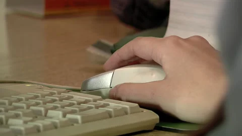 Hand of a Woman Holding Computer Mouse at the Reception Desk in A Hospital. Stock Footage 248731189