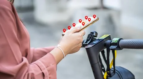 Hand woman in holding smartphone hands and using maps app before riding Stock Photos