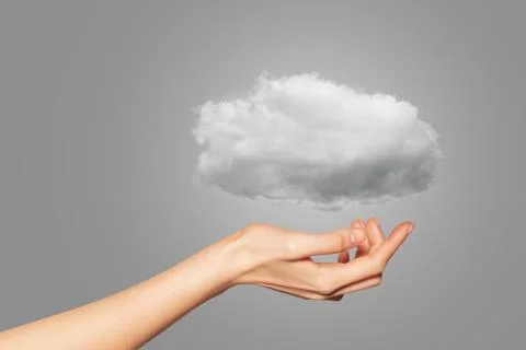 Hand of woman with light cloud - computing concept Foto stock