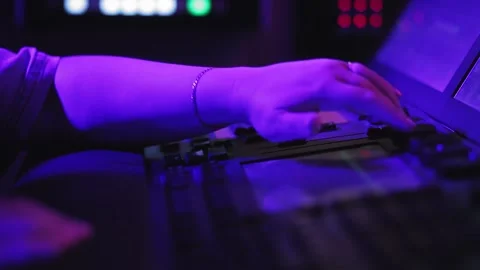 Hand A woman lighting engineer at the control panel controls the lighting Stock Footage 156465327