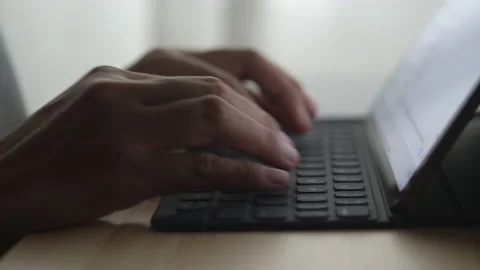 Hand of woman using digital tablet at home night Stock Footage 132431149