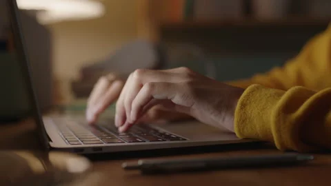 Hand of woman using laptop computer to work, typing at home Stock Footage 143000375
