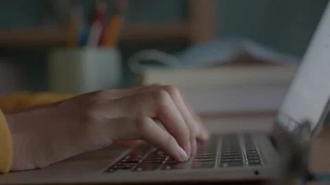 Hand of woman using a laptop computer to work, typing at home Stock Footage 147161601
