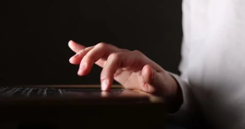 Hand of woman using laptop computer to work, typing at home and scrolling, wh Stock Footage 300363837