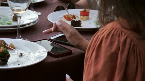 Hand of a woman using a mobile phone reads a phone message and browses the news Stock Footage 278869413