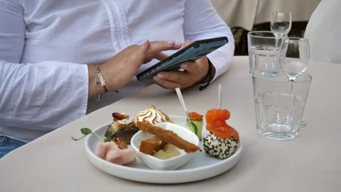 Hand of a woman using a mobile phone, reading a phone message and viewing news Stock Footage 282829727