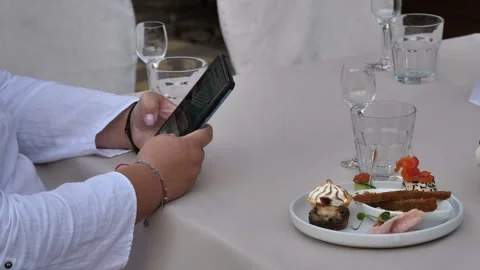 Hand of a woman using a mobile phone, reading a phone message and viewing news Stock Footage 282829816