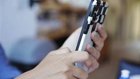 The hand of a woman using a smartphone Stock Footage 248301524