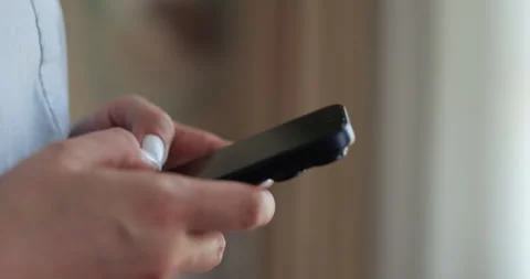 Hand of woman using texting mobile phone or chat. Close up of woman hand. Stock Footage 335885137
