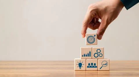 Hand woods block cube with icon company strategy development, Concept success Stock Photos