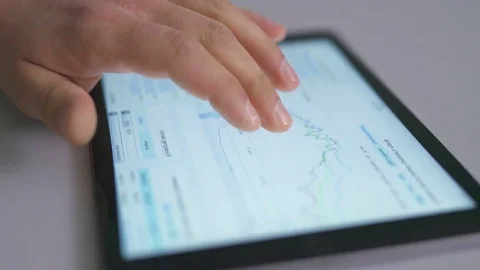 The hand work with a tablet. Graph on the screen Video stock 73759981