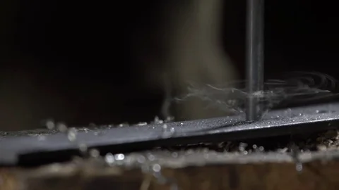 Hand of the worker drill metal and flying metal chips. Metalworking Stock Footage 72532728