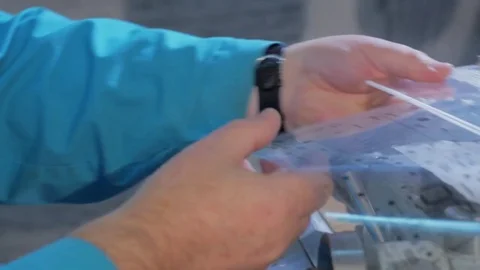 Hand of the worker drill workpiece. Electronics manufacture. Stock Footage 69885398