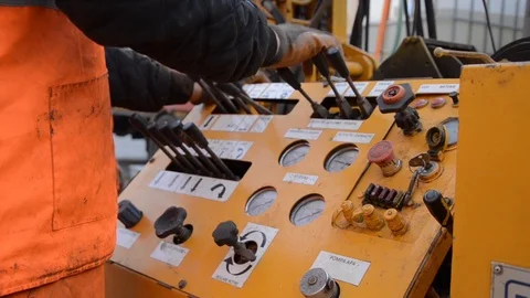 Hand of a worker operates a machine levers of command of deep sea drilling Stock Footage 95800152