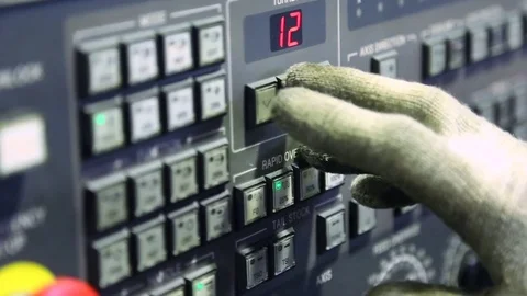 The hand of the worker press the keys of the CNC control Stock Footage 82116887