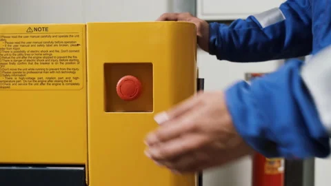Hand of worker pushing red emergency button STOP. Equipment shutdown in case of Stock Footage 142950189
