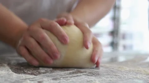 Hand working Dough on table counter with flour. Baking concept. Stock Footage 145441827