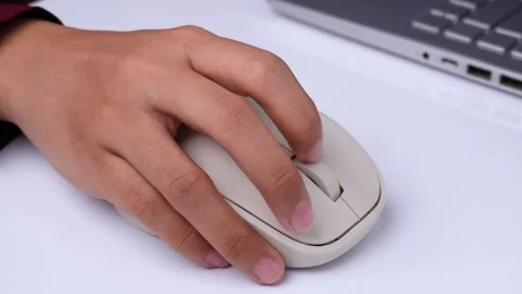 Hand working with mouse and laptop on white table high angle shot Stock Footage 270898845
