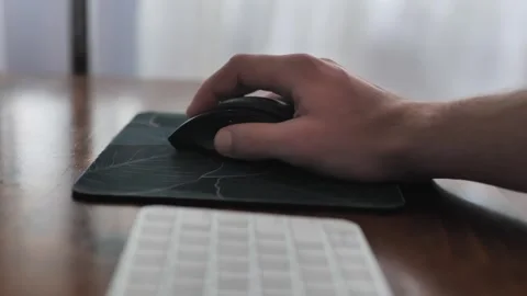 Hand working on pc mouse on control panel desk. Man on computer on a Stock Footage 276827451