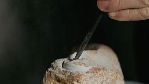 Hand working stone with tool isolated on black background. Media. Hobbies and Stock Footage 220184277