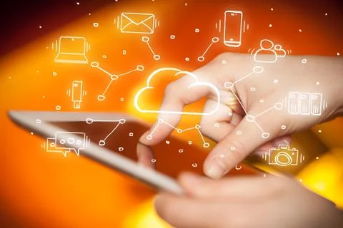 Hand working on tablet with cloud technology system concept Stock Photos