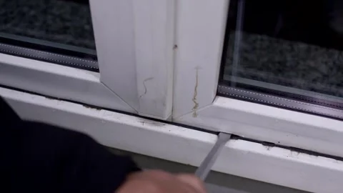 Hand Working on White Plastic Window Frame with Tool, Renovation, Close Up Shot Stock-Footage 341527116
