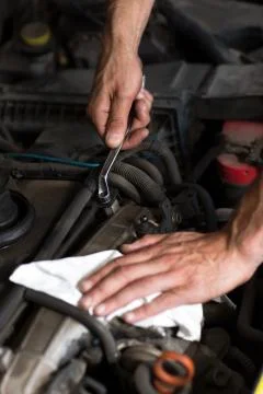 Hand with wrench close up Stock Photos