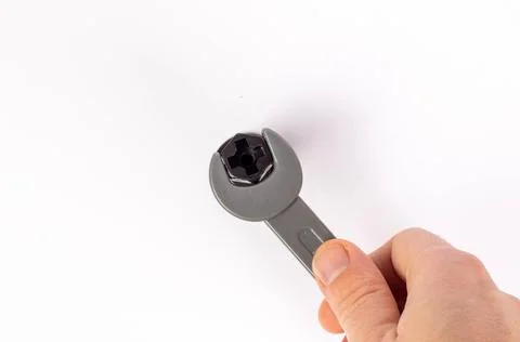 The hand with the wrench Stock Photos