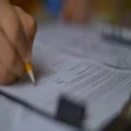The hand write and crumple a paper. Slow motion 4k or 4k+ Resolution