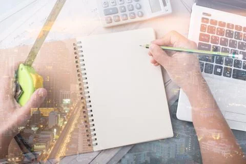 Hand write on note book double exposure with city light Stock Photos